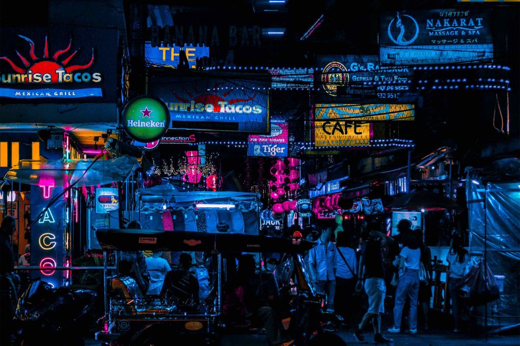 Gay Travel Thailand: bustling Silom at night with its neon signs. 