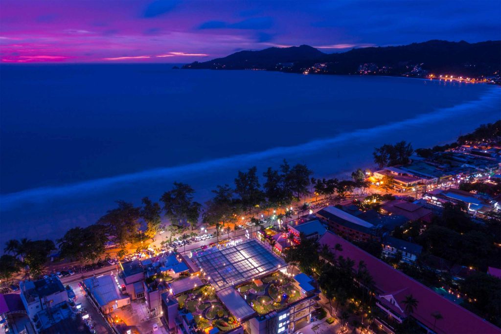 Gay Travel Thailand: sprawling scenes of Patong beach just after sunset. 